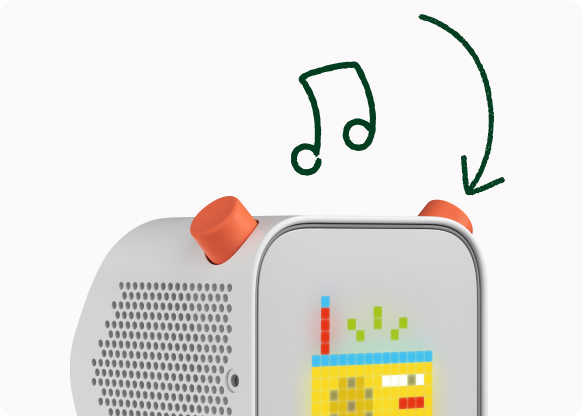 A finger pressing the right orange control on a Yoto Player while a radio icon shows on the display.
